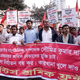epa05686314 Workers and leaders of the Garments Sromik Front attend a rally protesting the arrests of their leaders and termination of workers from several factories following unrest in Dhaka, Bangladesh, 23 December 2016. At least 278 workers of two readymade garment factories were terminated for instigating labor unrest at Ashulia industrial belt on 21 and 22 December 2016, while the workers have been demonstrating and demanding increase of minimum wage to Euro 200 from Euro 66.25 since 11 December 2016. EPA/ABIR ABDULLAH